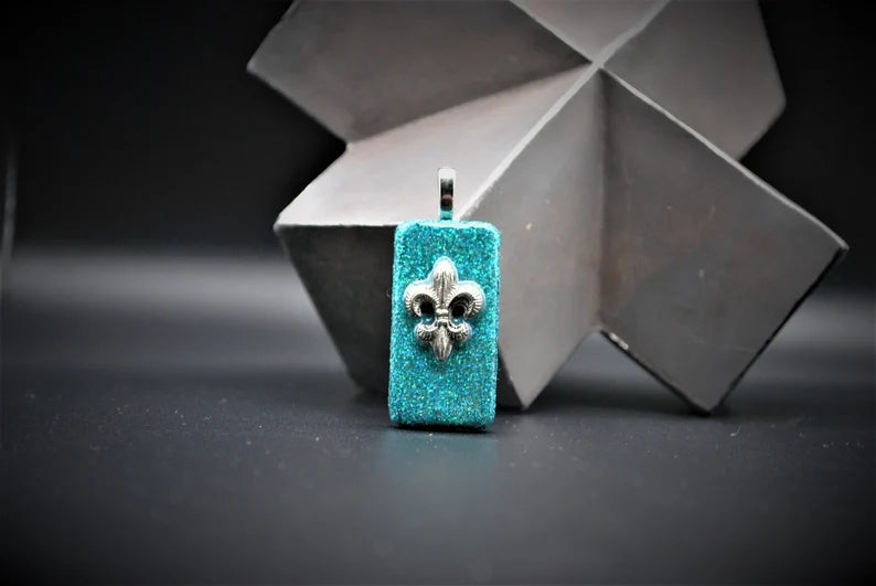 Turquoise Glittered Domino Pendant with Fleur de Lis Charm